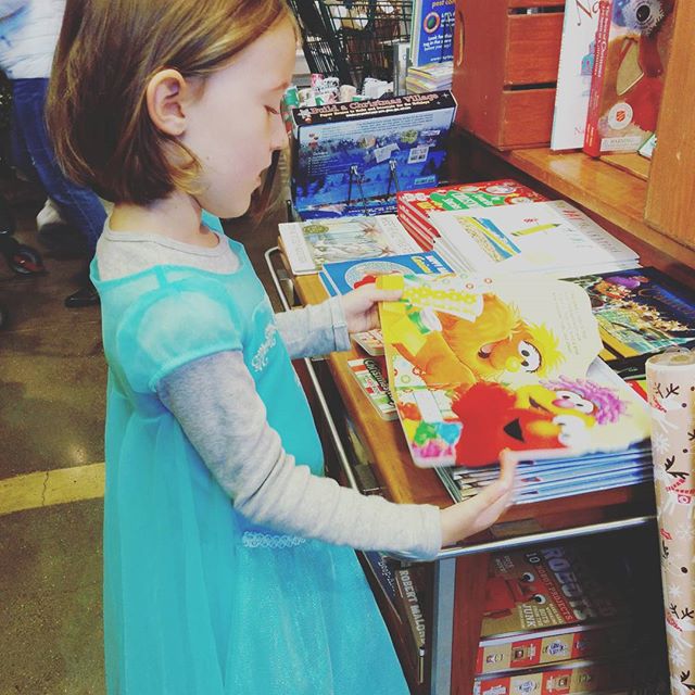 Always in dress up. Always reading books. Even in Whole Foods.