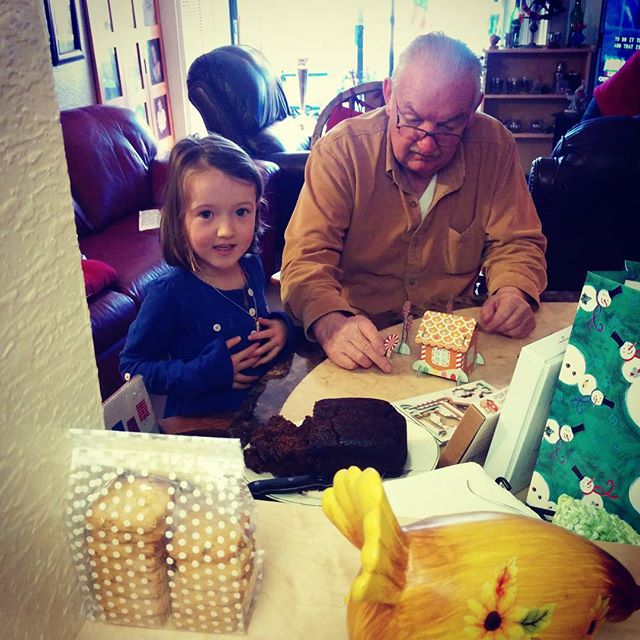 Emma & Grandpa making a pop out gingerbread house