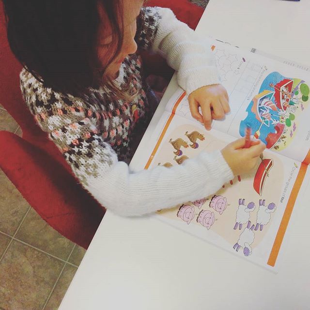 This kid loves workbooks. ^_^ I haven't started much in the way of schooling but she is always eager to learn more. Today she is using a pencil to circle number groups.
