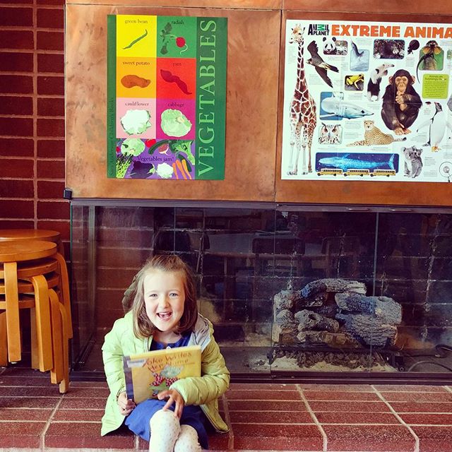 Reading books at the beautiful Parkside library branch.