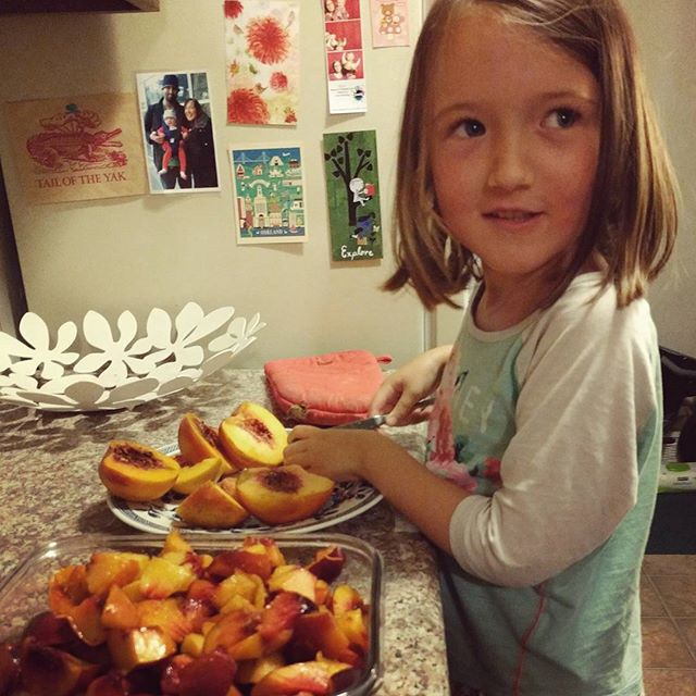 Cutting peaches & nectarines from our csa. Maybe pie tomorrow.