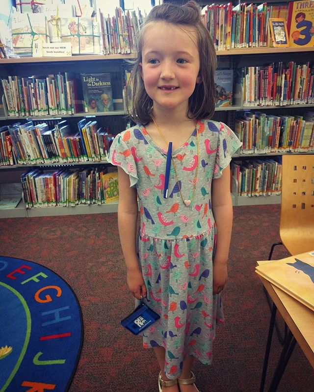 She got her own library card today!