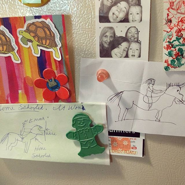 Grandpa's horse drawings on our fridge.