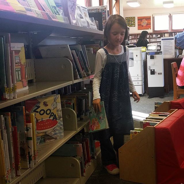 Found Clover alphabetizing books as she returned them them shelves.